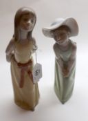 Two Lladro Figures: young girls in long summer dresses, numbered F25 and P21 to base (girl in