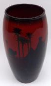 A Royal Doulton Flambé tapering wide necked Vase, decorated with a desert scene with Touaregs and