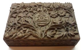 A Carved Hardwood Rectangular Box, the lid applied with a panel carved with military motto, void