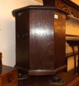 A 19th Century Oak Octagonal Commode, with swan neck handles to sides, raised on small bun feet (