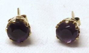 A pair of hallmarked 9ct Gold Amethyst Stud Earrings, (marks worn, A/F)