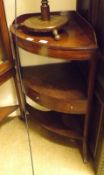 A 19th Century Mahogany Corner Wash Stand of typical form, the three shelves fitted with central