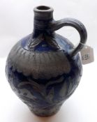 An 18th Century Westerwald Flagon, decorated with incised decoration of deer, stars etc, blue