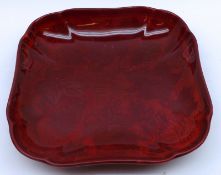 A Royal Doulton shaped Flambé Shallow Dish, decorated with grapes and vine leaves, the base signed