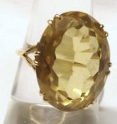 A large circa 1970s high grade yellow metal Dress Ring set with large cut oval Citrine (measuring