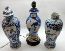 A pair of Oriental Vases of tulip baluster form, painted in underglaze blue with panels of figures