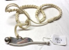 A cased Bosun’s type Whistle, with string lanyard, stamped 800