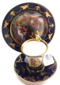 A Vienna Cabinet Trio comprising of gilt-handled Cup with painted panel of musical lovers, Saucer