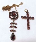 An attractive Edwardian Gold Plated and all red stone Articulated Pendant on trace chain; together