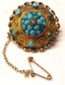 A Victorian Gold Circular Brooch, the raised centre pavé set with Turquoise stones and central small