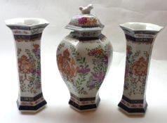 A Samson Three Piece Garniture, comprising a Lidded Baluster Vase and a pair of matching Trumpet