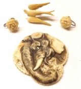 A Packet containing a Carved Ivory Panel of an elephant’s head; a pair of Earrings and Bone