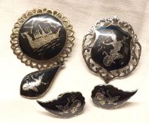 A Sterling Silver (Made in Siam) Suite of two Brooches (one with hanging pendant) and a pair of