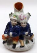 A 19th Century Staffordshire Spill Vase Group, modelled as two hearty good fellows in blue robes,