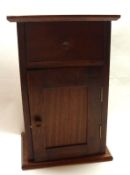 A late 19th Century/early 20th Century Mahogany Table Top Cabinet with one drawer and one door,