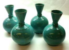 A set of four Oriental Green Glaze Baluster Vases with trumpet necks, terminating in moulded collars