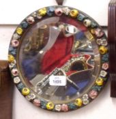 An early 20th Century Easel Back Round Dressing Table Mirror, framed decorated with moulded coloured