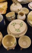 A Belleek part Tea Service typically decorated with shamrock detail, comprising Teapot, four Cups,