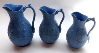 A Graduated Set of Three Brownfields Blue Glaze Jugs, “International” pattern, (smallest example