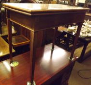 A late 19th Century Mahogany Fold Top Card Table, crossbanded and boxwood strung top over a plain