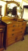 A late 19th Century Oak Dressing Chest, fitted with tilting mirror, two short and full length