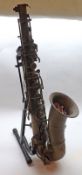 An early 20th Century Boosey & Co Tenor Saxophone, in Yellow Metal, approved by E. Mills, retailed