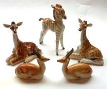 A pair of USSR/Lomonosov Giraffes; a pair of Antelopes and a Zebra, largest piece 6” high (5)