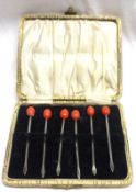A cased set of six Cocktail Sticks with red bead tops, Birmingham 1928