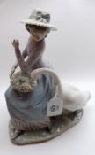 A large Lladro Figure of young lady with goose, marked Daisa 1979 and further numbered E13S to base,