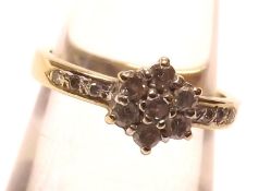 A hallmarked 9ct Gold Diamond Set Cluster Ring of flower head design with stone-set shoulders