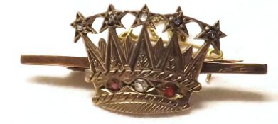 An unmarked yellow metal Naval Bar Brooch with central mounted curved crown, set with red and