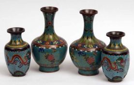 Two pairs of Cloisonné Baluster Vases, comprises a larger pair decorated with sprays of foliage on a