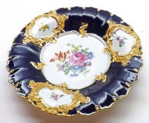 A 20th Century Meissen Round Shallow Dish, decorated with central coloured floral sprays to a blue