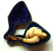 A short cased Meerschaum Pipe, the bowl modelled as a bearded gent’s head, mouthpiece detached, 4”