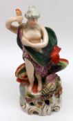 A 19th Century Staffordshire Model of Goddess and Dolphin, decorated throughout in colours, raised