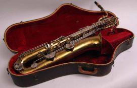 Rene Dumont Gold Lacquered Baritone Saxophone with stencilled drum, white metal and mother-of-