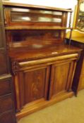 A William IV or early Victorian Mahogany Chiffonier, the panelled back with two shelves on turned