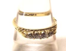 A high grade precious metal Ring set with five small Brilliant Cut Diamond, carved shoulders,