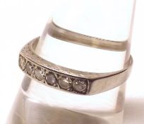 A precious metal Ring, channel set with six small Brilliant Cut Diamonds
