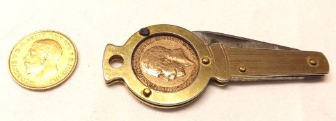 A George V Gold Half-Sovereign, 1913; together with a Gold Plated Cased Penknife with coin inset (2)