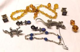 A Mixed Lot comprising: an orange Glass Bead Necklace; a white metal and Marcasite Lizard Brooch x