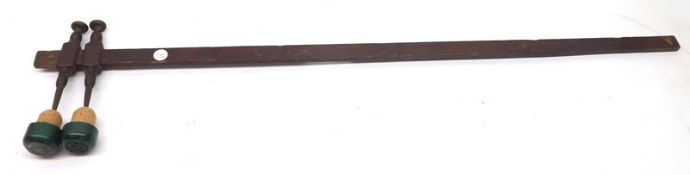 A Vintage Oak Shafted Measuring Stick, with two adjustable metal pointers, named F Ballard, 25” long