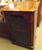 A small Victorian Walnut Veneered and Inlaid Music Cabinet, of typical form with single glazed door,