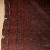 A 20th Century Caucasian Carpet with multi-gull border, central panel of geometric designs, mainly