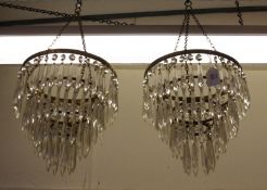 A pair of early 20th Century Four Tier Hanging Centre Ceiling Light Shades with clear prismatic