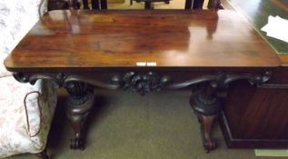 An early Victorian Rosewood Side or Library Table, of rectangular form, raised on two fluted