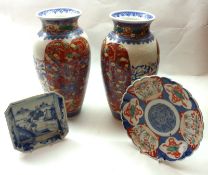 A pair of Oriental Circular Baluster Vases, decorated with panels of dragons in underglaze blue on