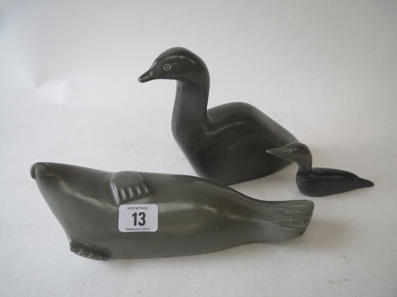 Two North Canadian soapstone figures, a recumbent seal and a duck