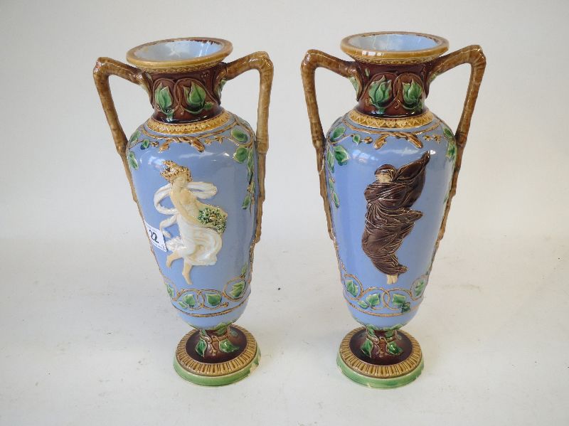 Pair of Minton majolica two handled amphora shaped vases with raised decoration of ivy leaves and