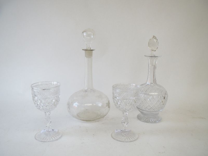 Victorian cut glass decanter, another etched vine leaves and two cut glass wine glasses